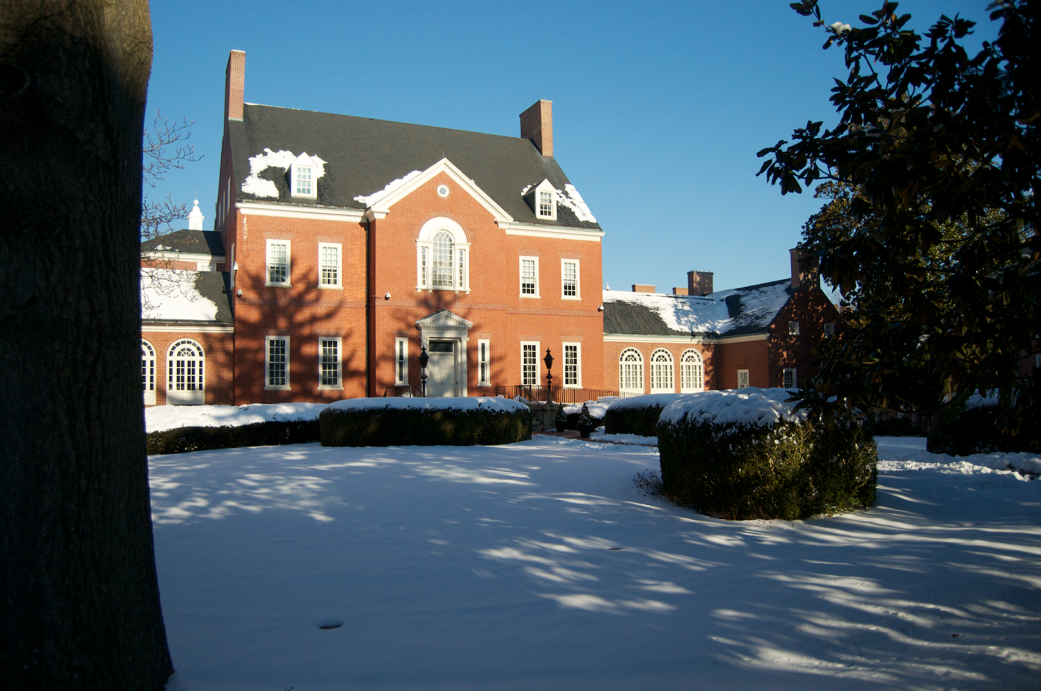 an older building with snow on the ground