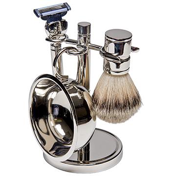 a silver bowl razor and metal shaving set with three razors