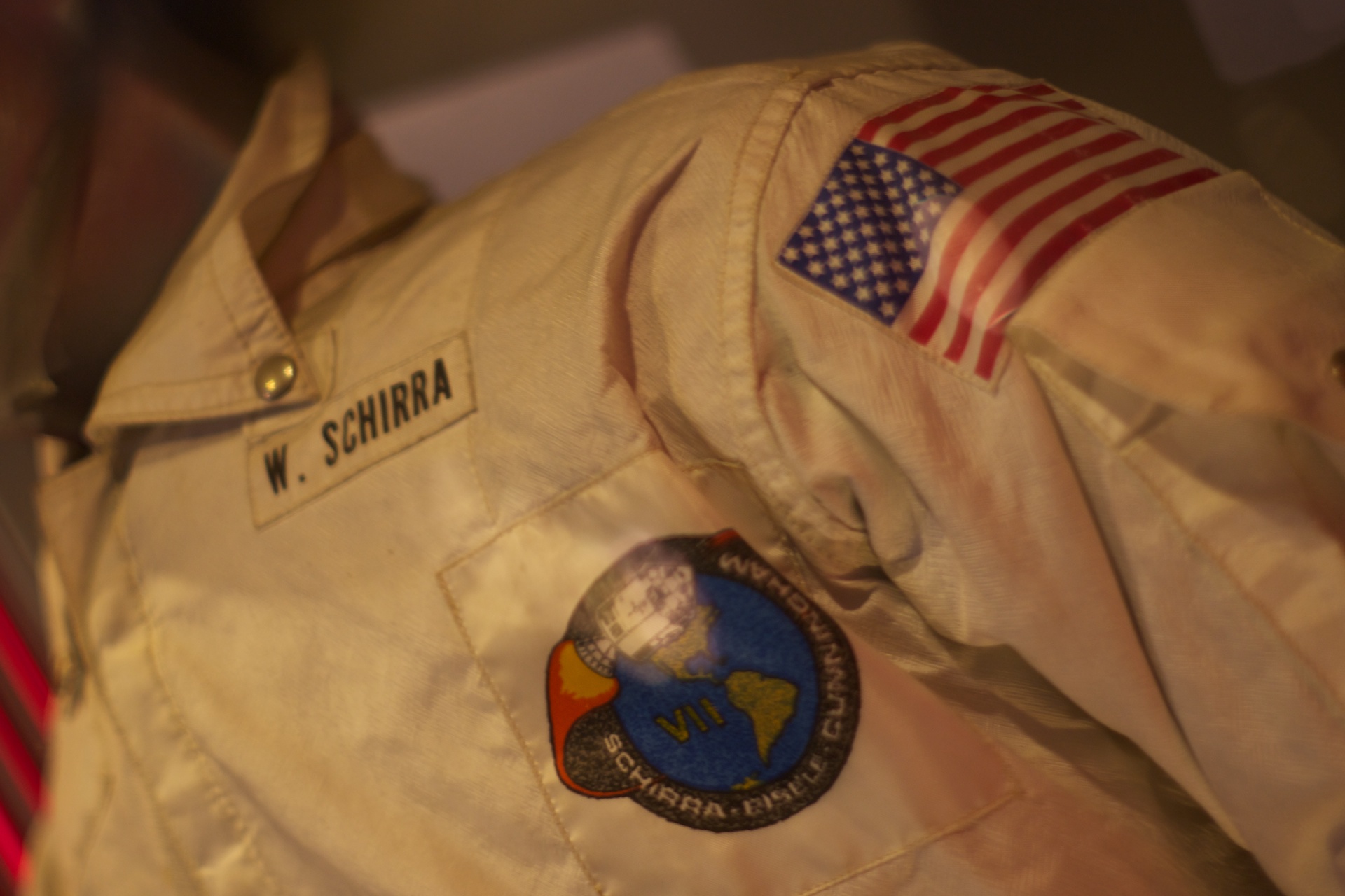 an air force shirt with badges, usa flag and a w schinra insignia