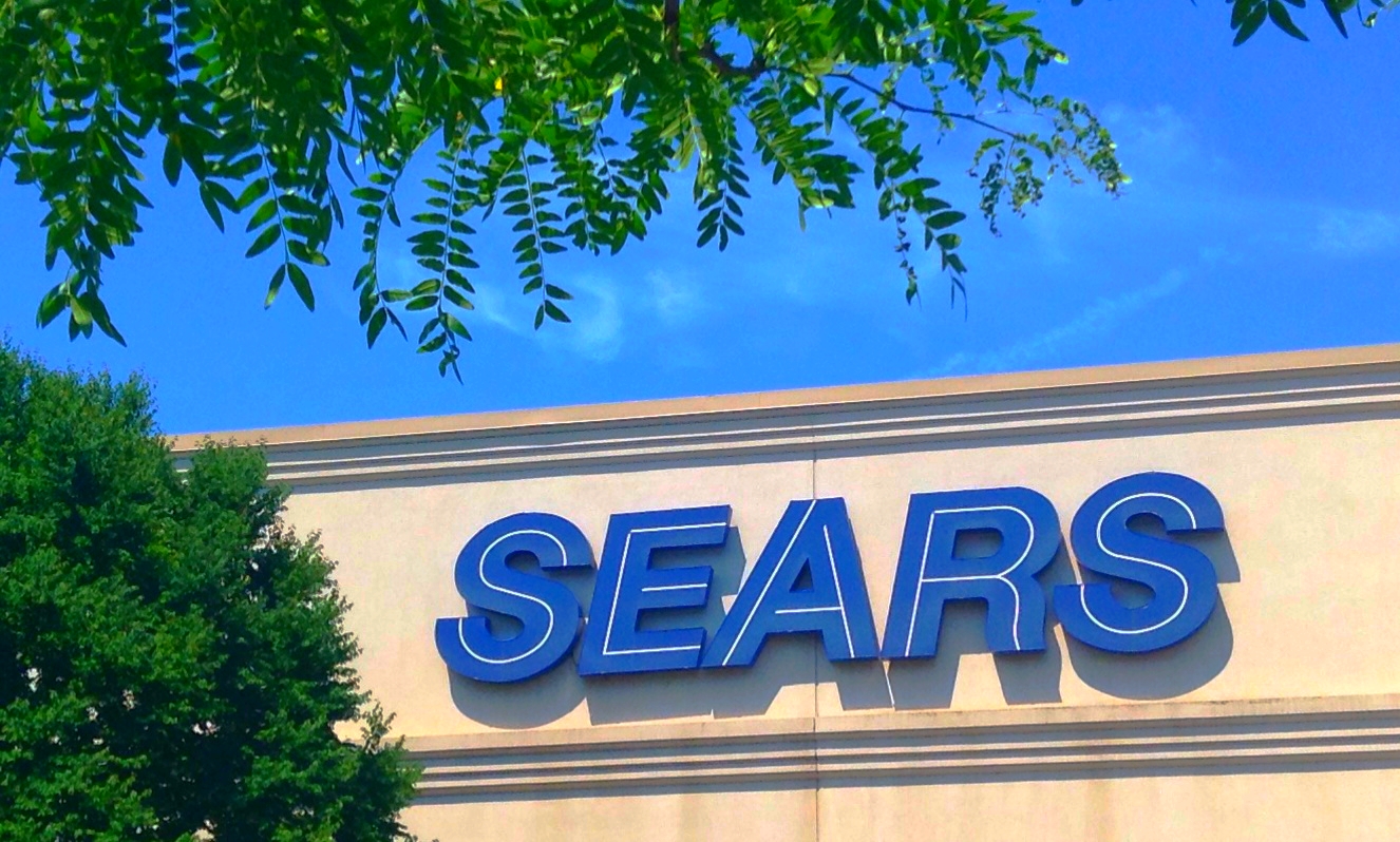 a sears store sign on top of a store