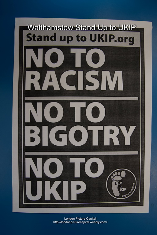 a sign on the wall stating no racism to racism to big city no to stupid people
