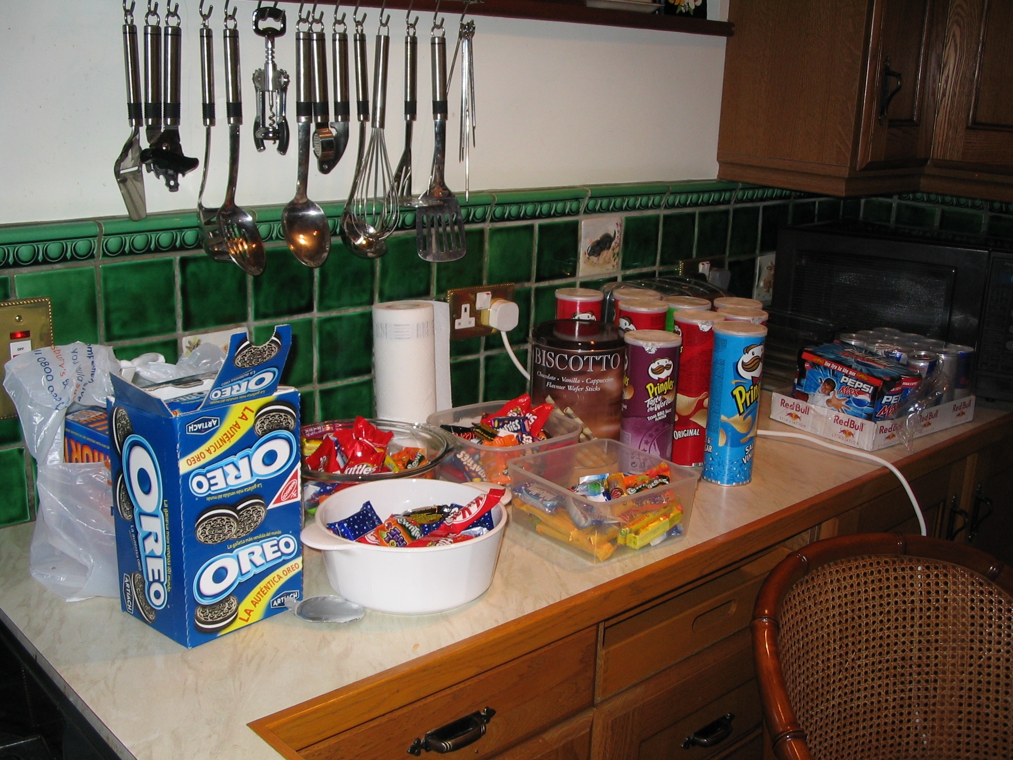 a kitchen counter full of snacks, candy, and more
