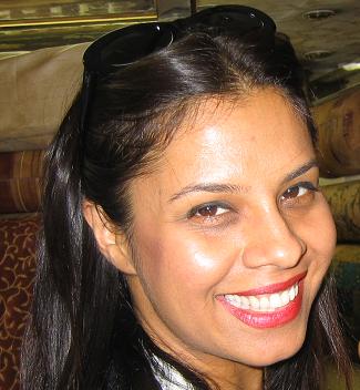 a woman smiling while looking up at the camera