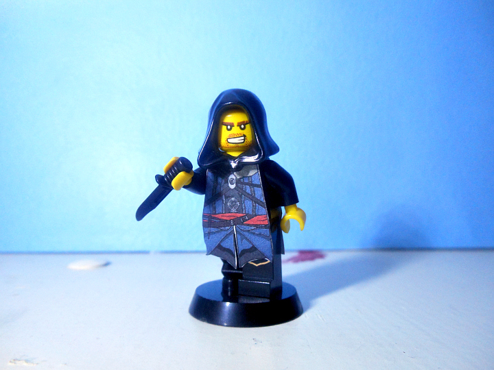 a lego figure with a microphone and a jacket on