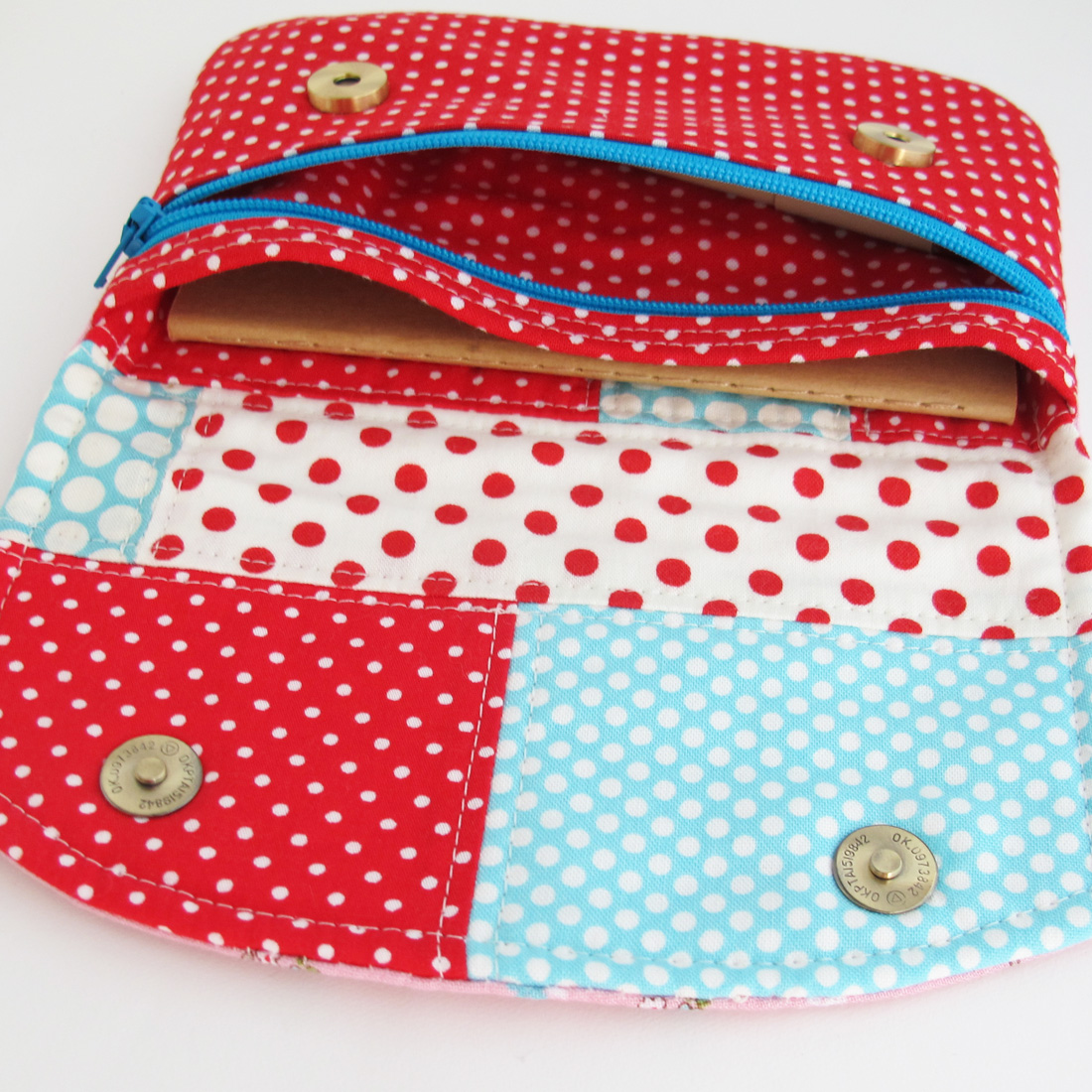 a piece of polka dotted fabric sitting in an empty pouch