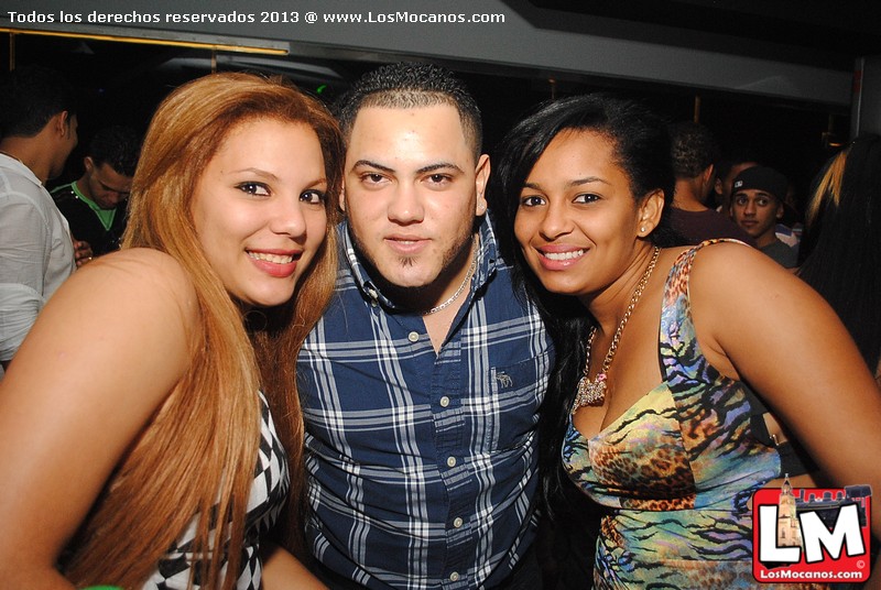 two girls pose with two young man in front of them at the club