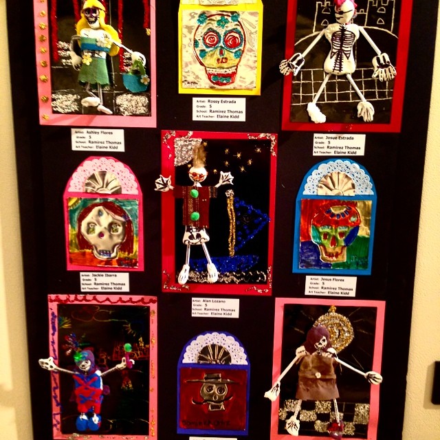 a halloween bulletin board with skeletons and day of the dead decorations