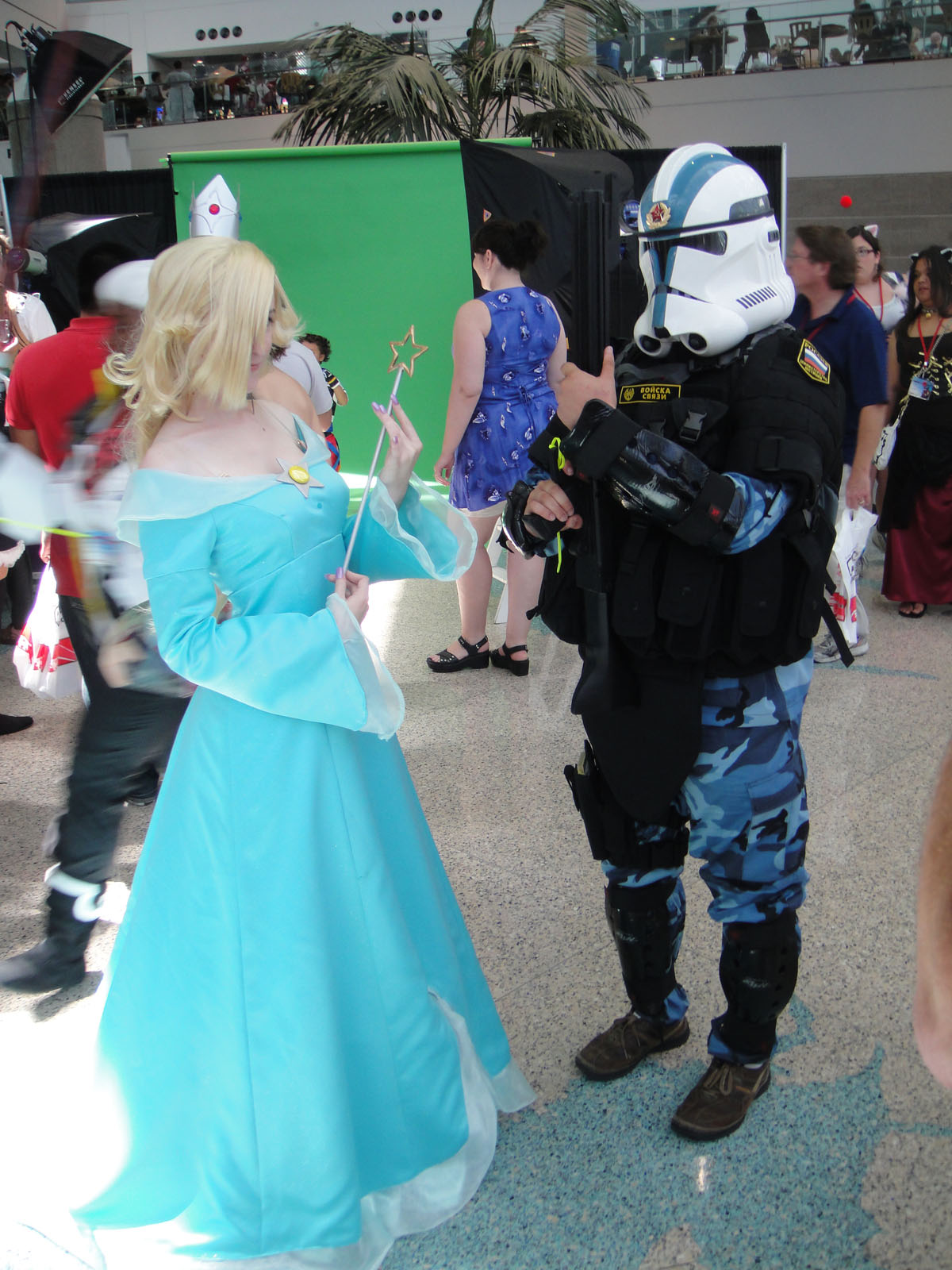 this is two people dressed as stormtrooper and princess aurora