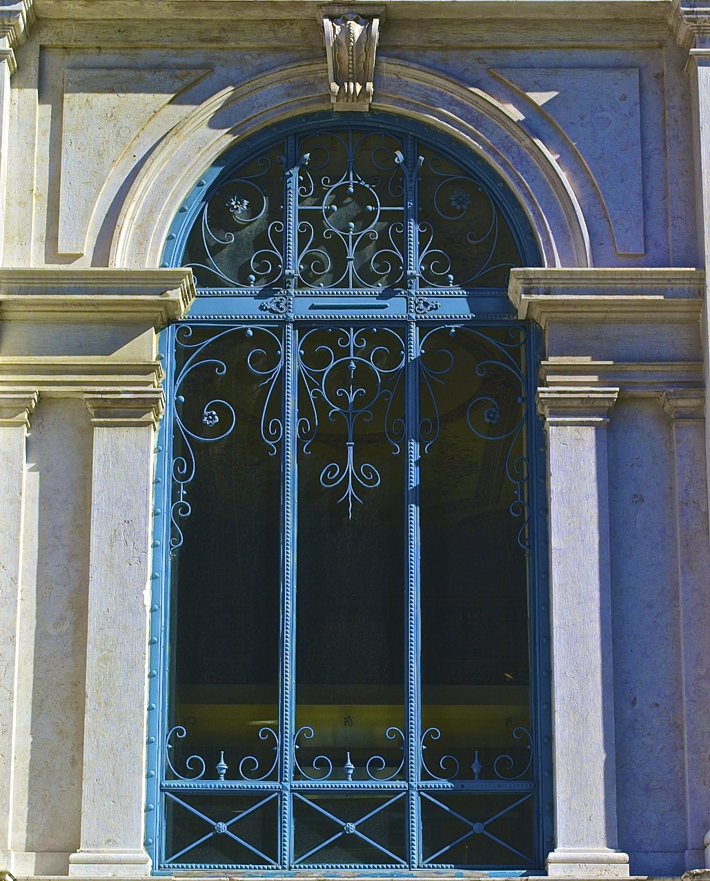 an ornate window and the side of a building