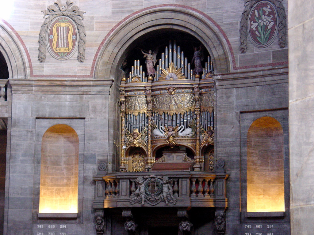 a large organ in the middle of a church