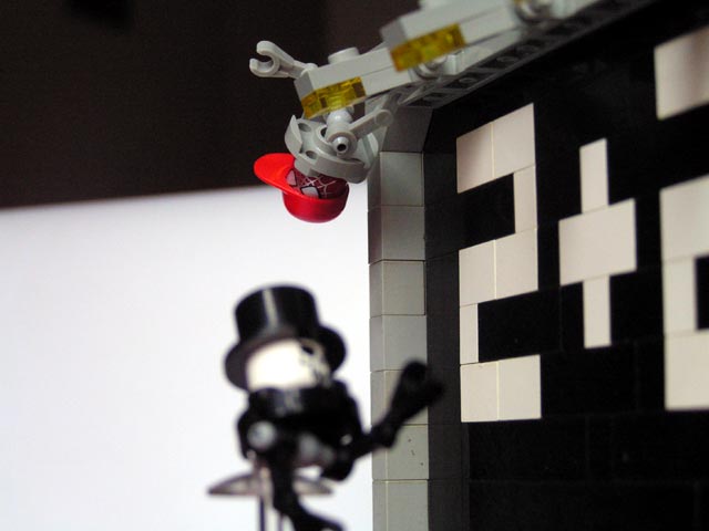 a lego person has been stuck into a wall