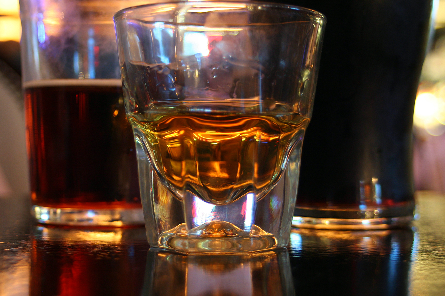 a half filled glass sitting on a table