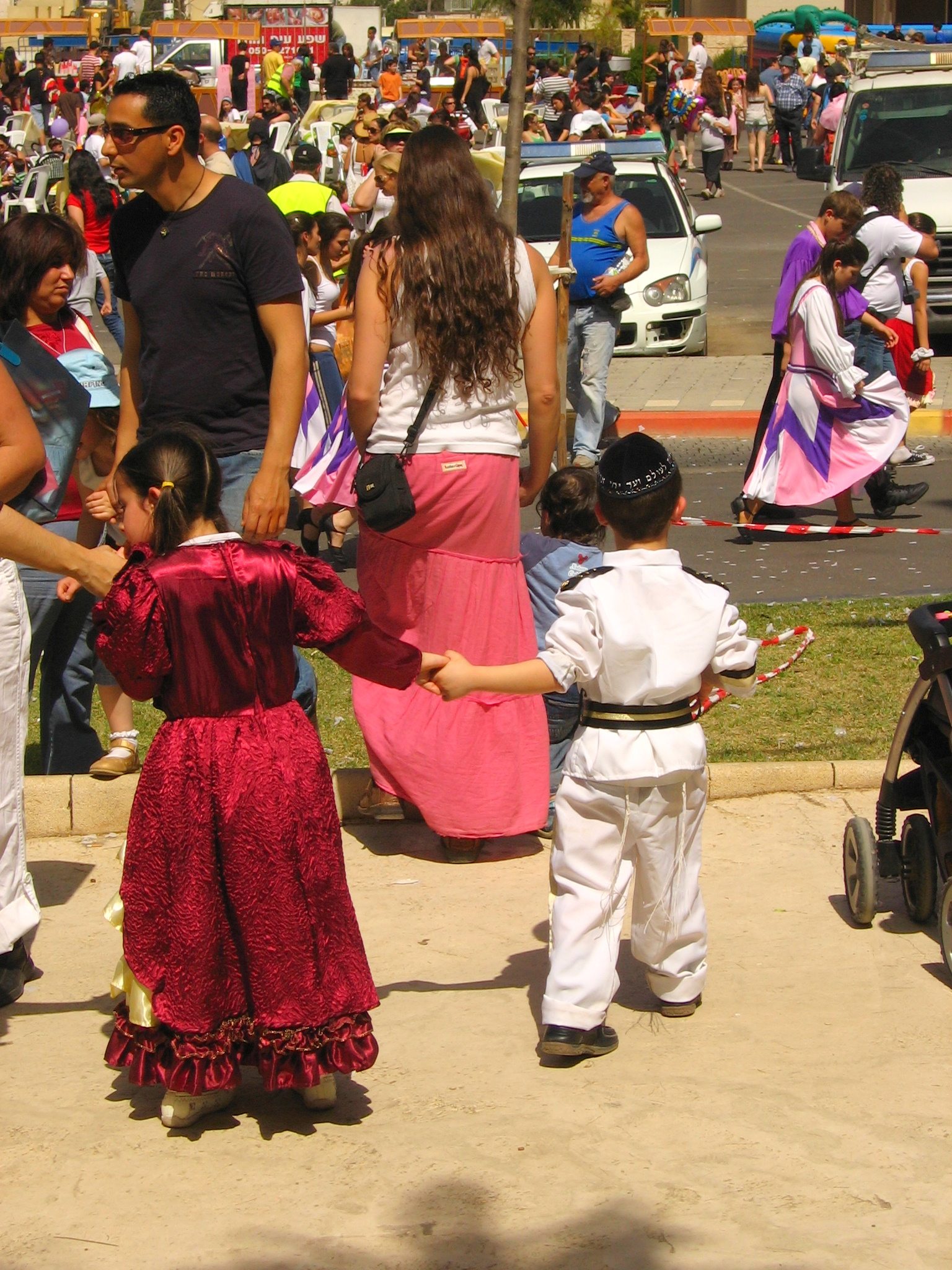 a little boy and girl play with other people