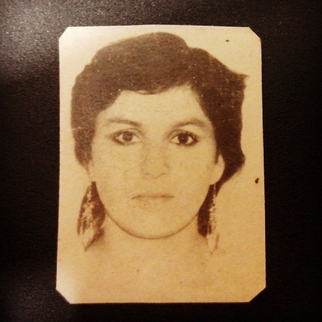 an old picture of a woman with brown hair