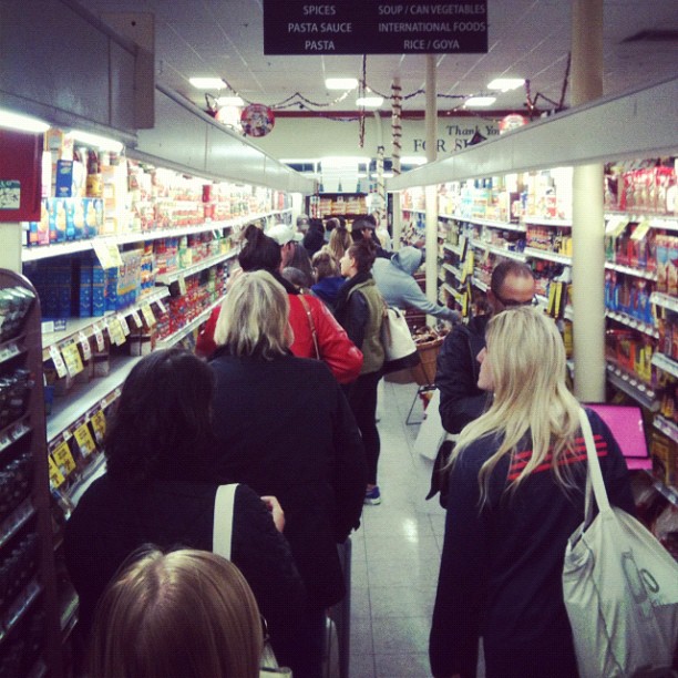 a group of people are standing in a store