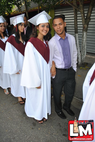 the two people are dressed up for a graduation