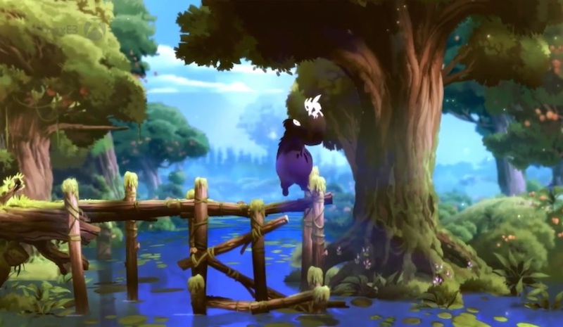 a purple cat stands on a bridge in a forest