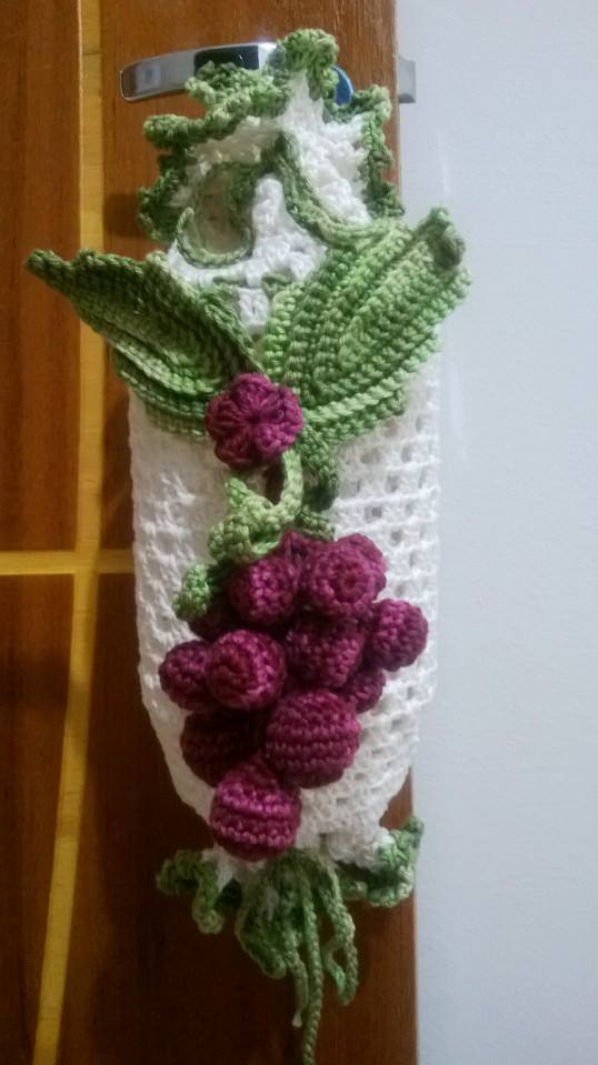 a crocheted scarf with gs and leaves