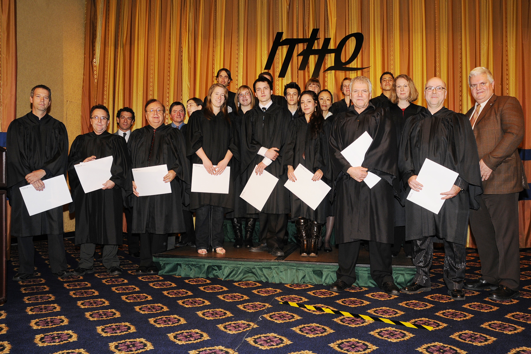 a group of men in black robes standing together