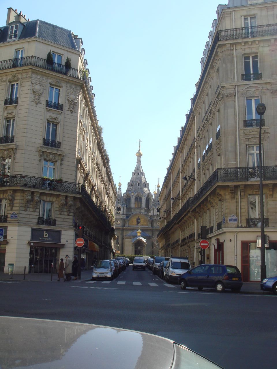 a street in a city with many buildings and traffic