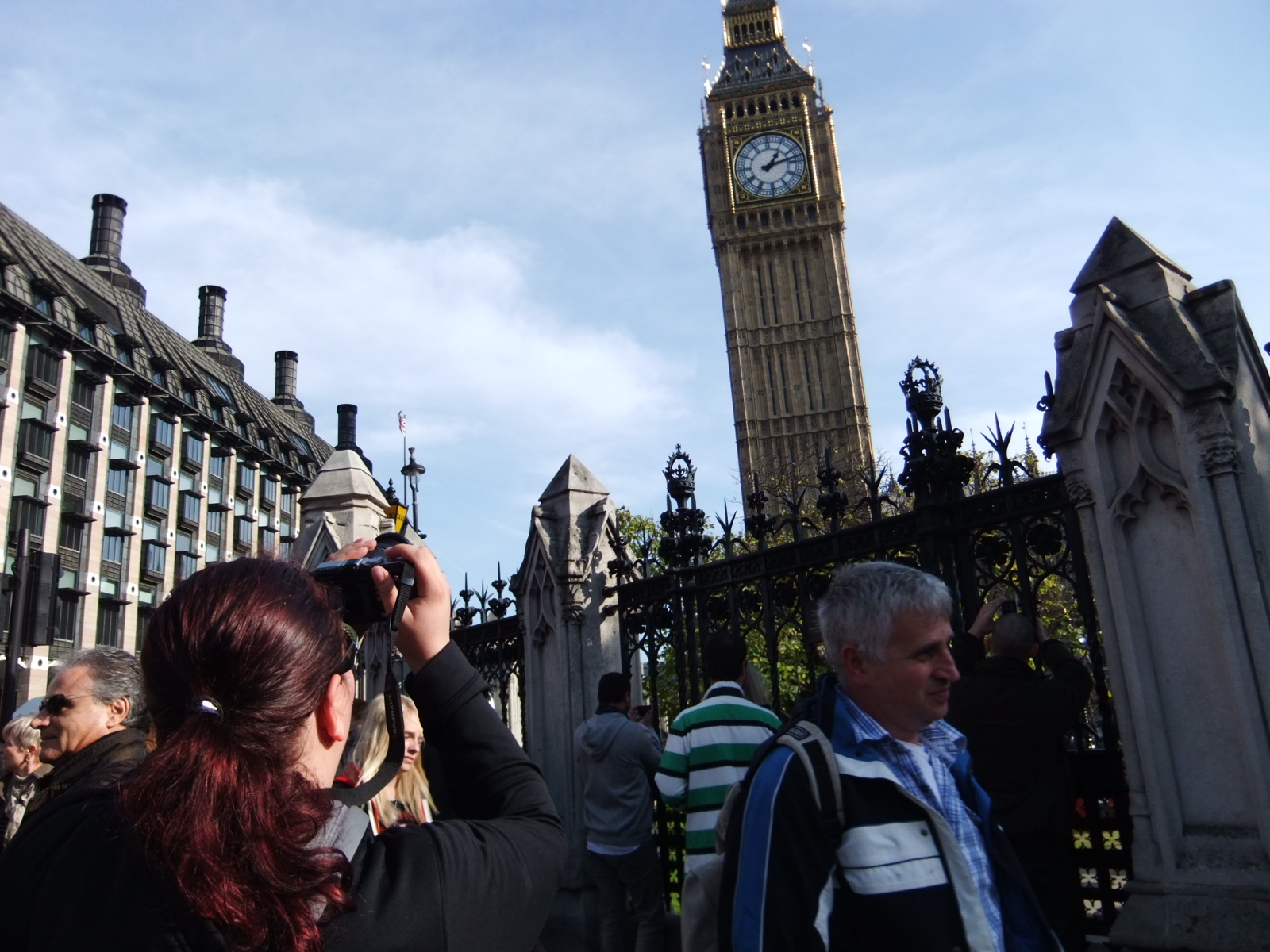 a woman is taking a po of the clock tower