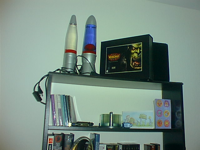 several electronic items sit on a shelf