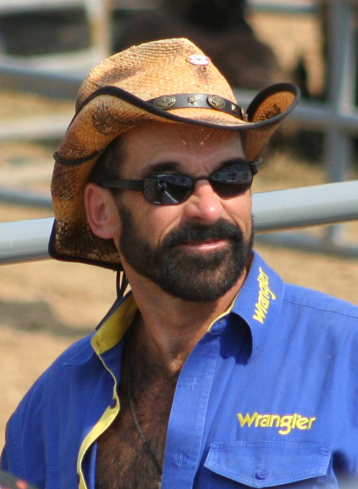 a man with a cowboy hat and sunglasses