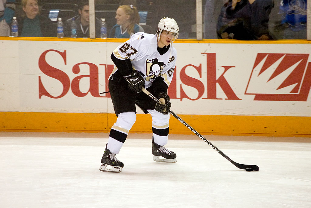 a hockey player is standing in the middle of a game