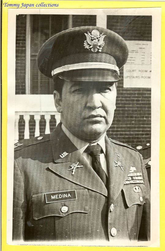 an old black and white po of a man in uniform