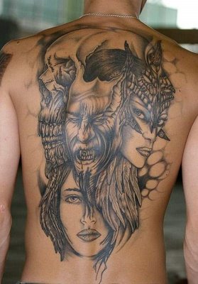 tattoo on back of man with woman and birds