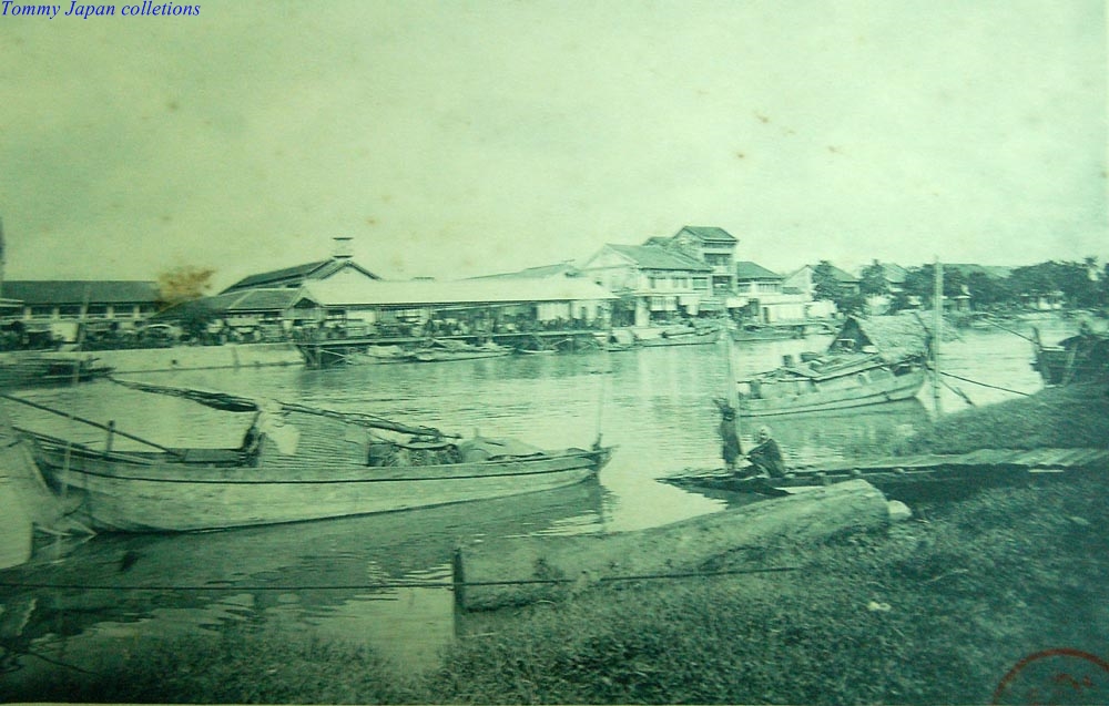 old time pograph of boatyard at river's edge