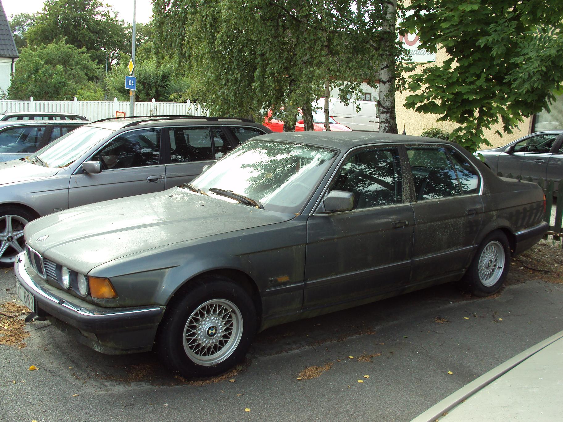 two cars parked side by side with one being off in front