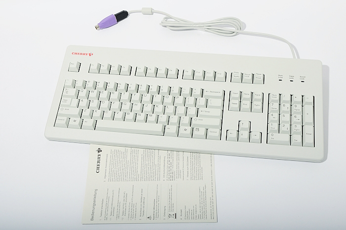 an apple computer keyboard and mouse sitting on a desk