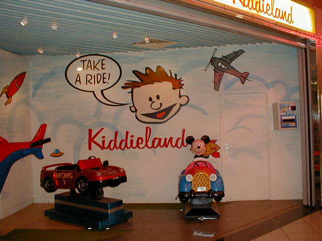 there are several toy cars and toys on display