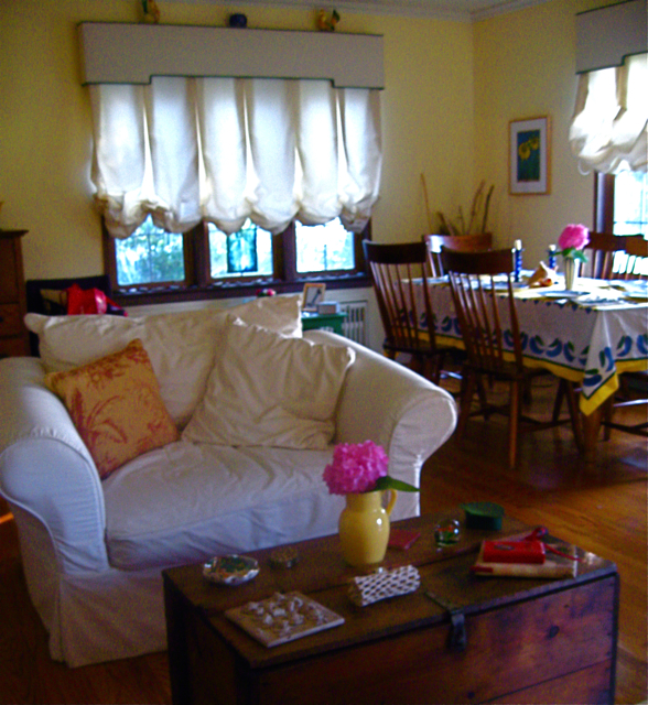 a living room filled with furniture and a table