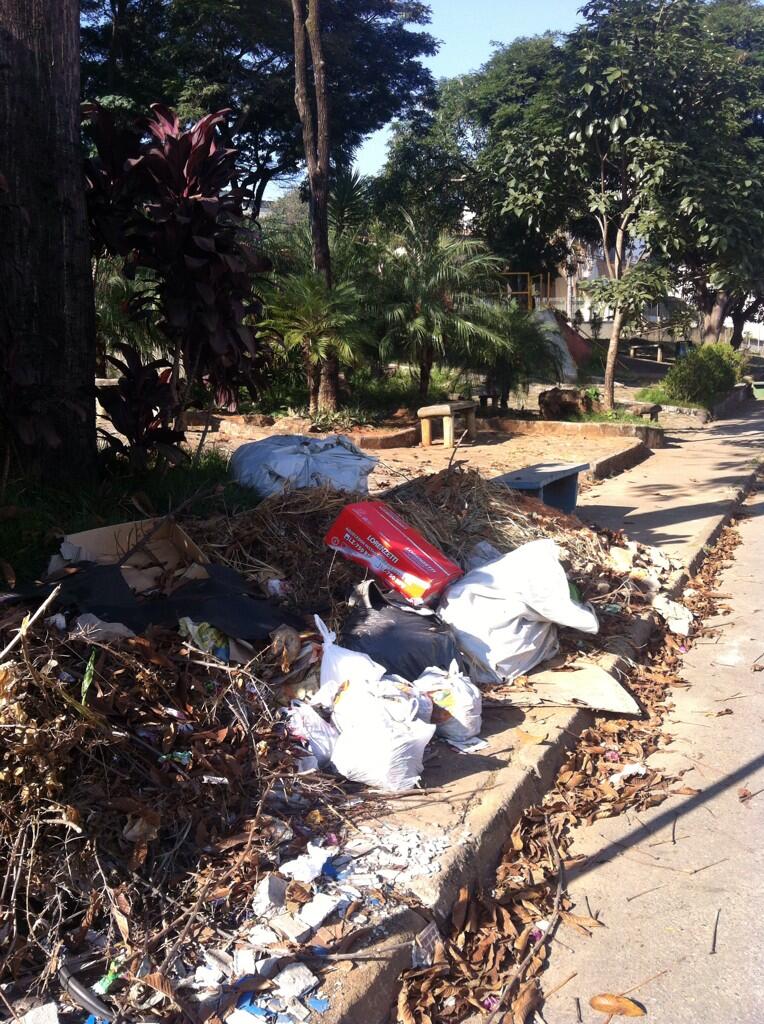 a street lined with garbage and trash on the side