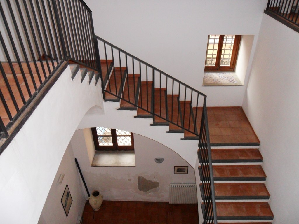 this is an aerial view of stairs with railing