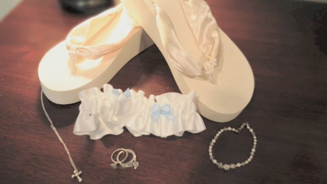 shoes, jewelry, celets and ring sit on a table