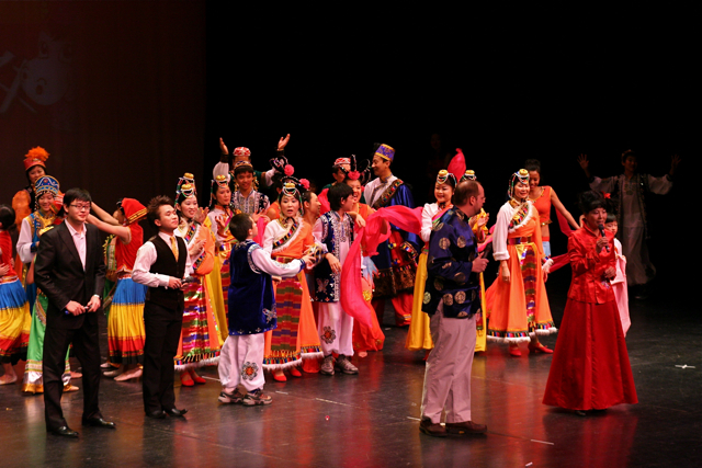 group of dancers with one person on the front and two others on the back