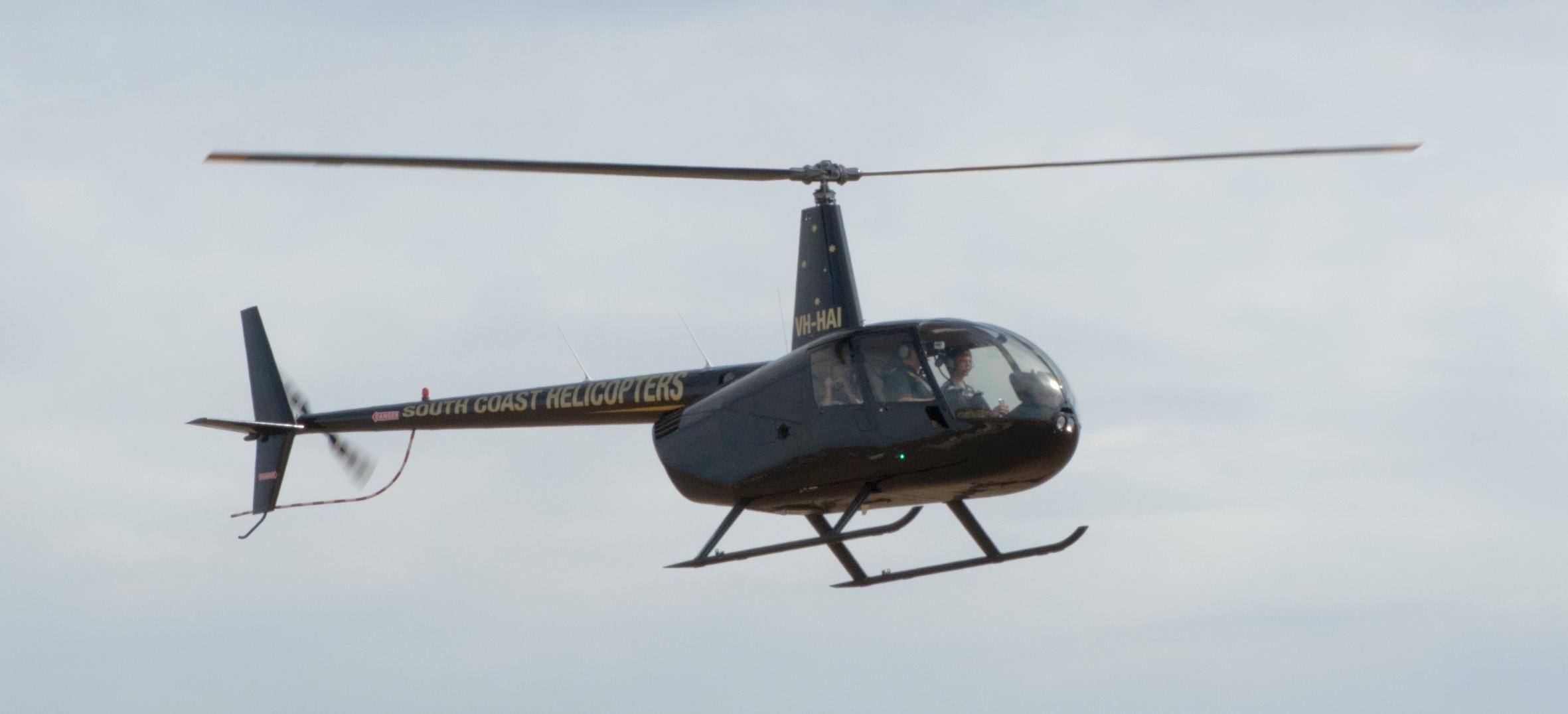 a helicopter is shown in the air with propellers