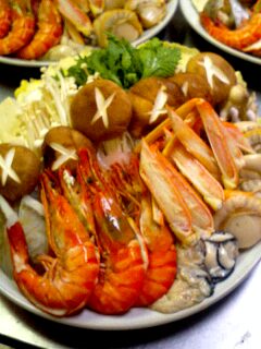 four plates with different types of lobster and other foods