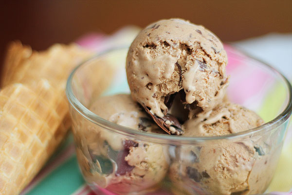 there are three scoops of ice cream sitting in a small bowl