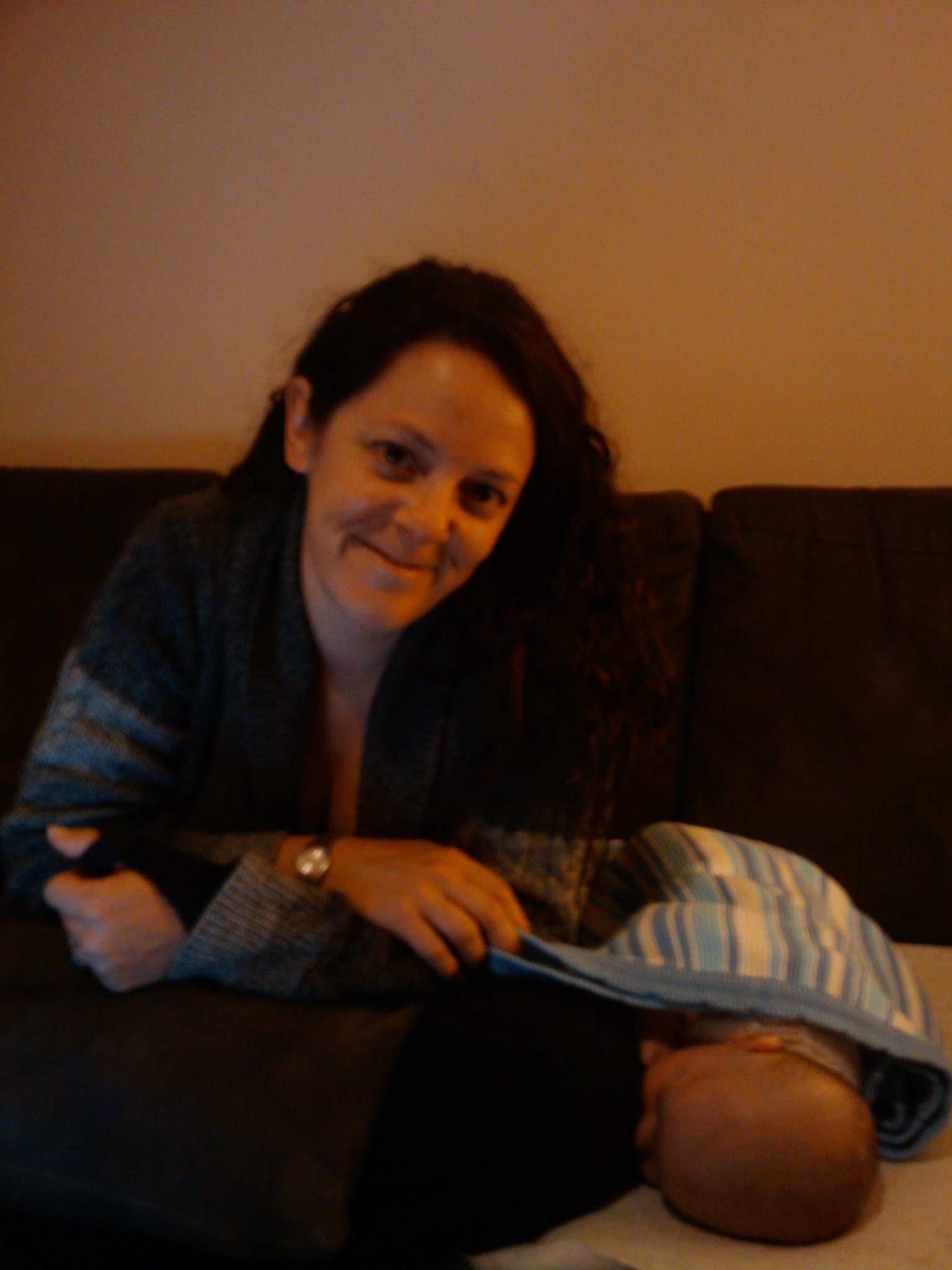 a woman on a couch holding a child