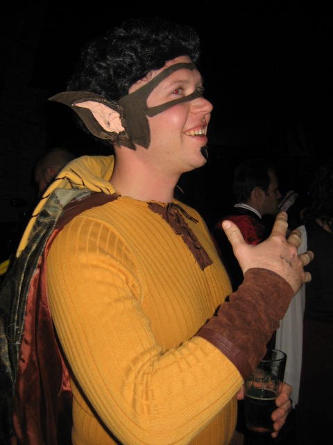 a man in a yellow and brown costume