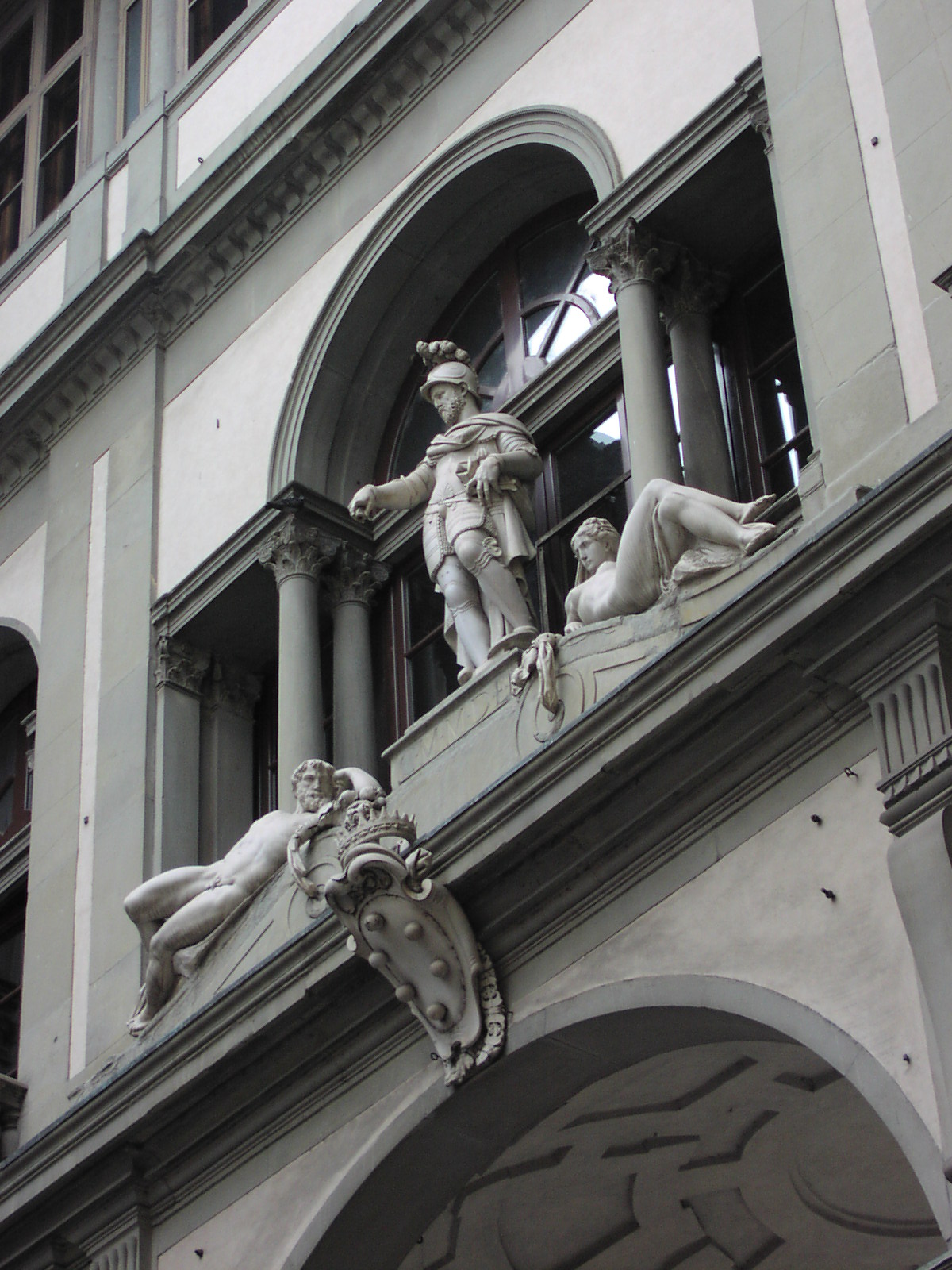 a group of statues that are next to a building