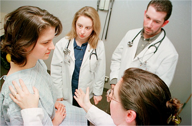 a group of medical workers are discussing