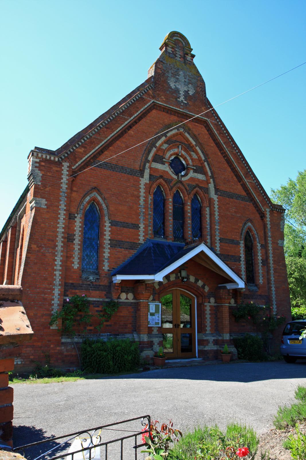 a very large red brick building with many windows