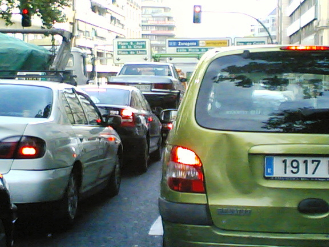 a number of cars on a city street