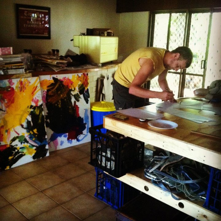 a man is making a homemade painting on a table