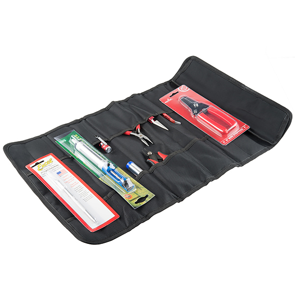 a large tool roll containing several tools in black